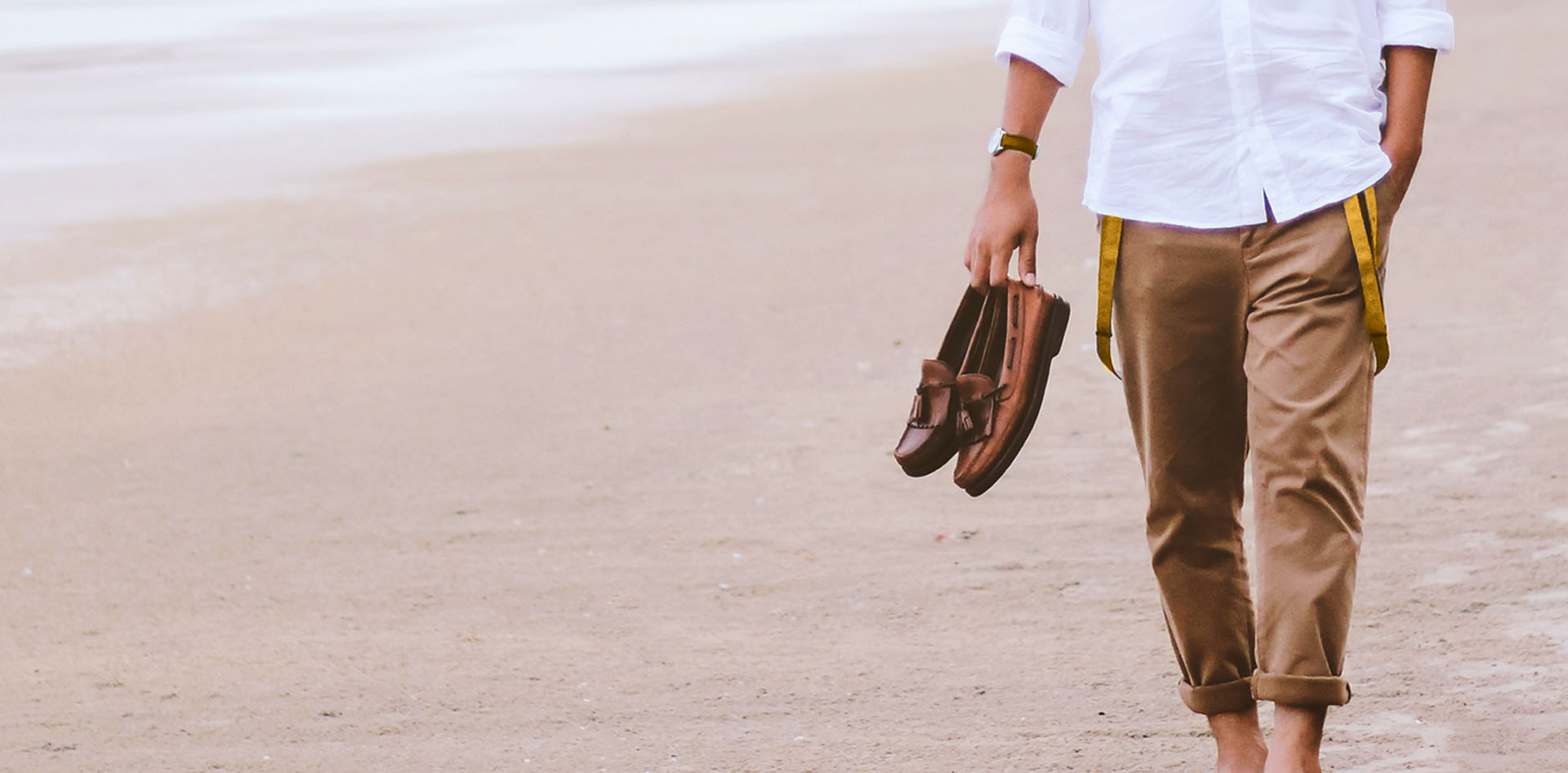 guy walking on beach